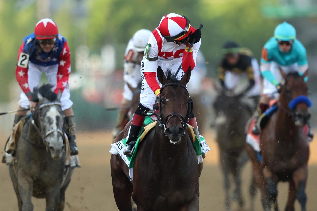 BALTIMORE, MARYLAND - MAY 21: Jockey Jose Ortiz #5 riding Early Voting celebrates after winning the 147th Running of the Preakness Stakes at Pimlico Race Course on May 21, 2022 in Baltimore, Maryland. (Photo by Patrick Smith/Getty Images)