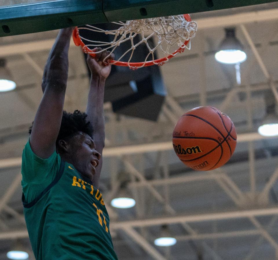 Indianapolis Crispus Attucks High School's Dezmon Briscoe  dunks during the boys Indianapolis city championship, Monday, Jan. 23, 2023, won by Crispus Attucks 61-51. 