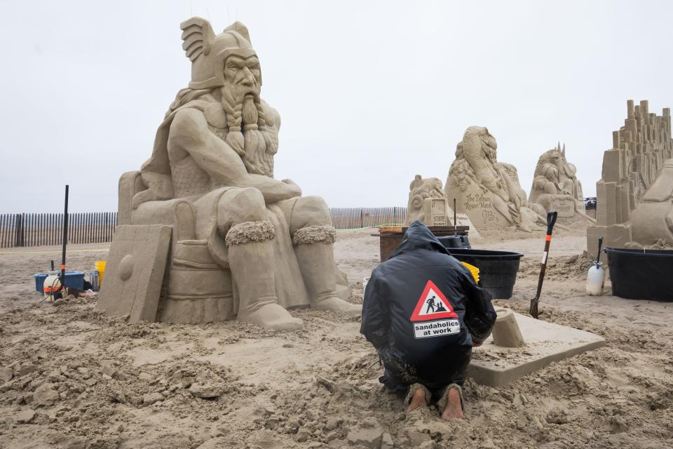 Carl Jara of Ohio works on "Obsolete." Jara said his sculpture represents an old man who just found out he's no longer needed.