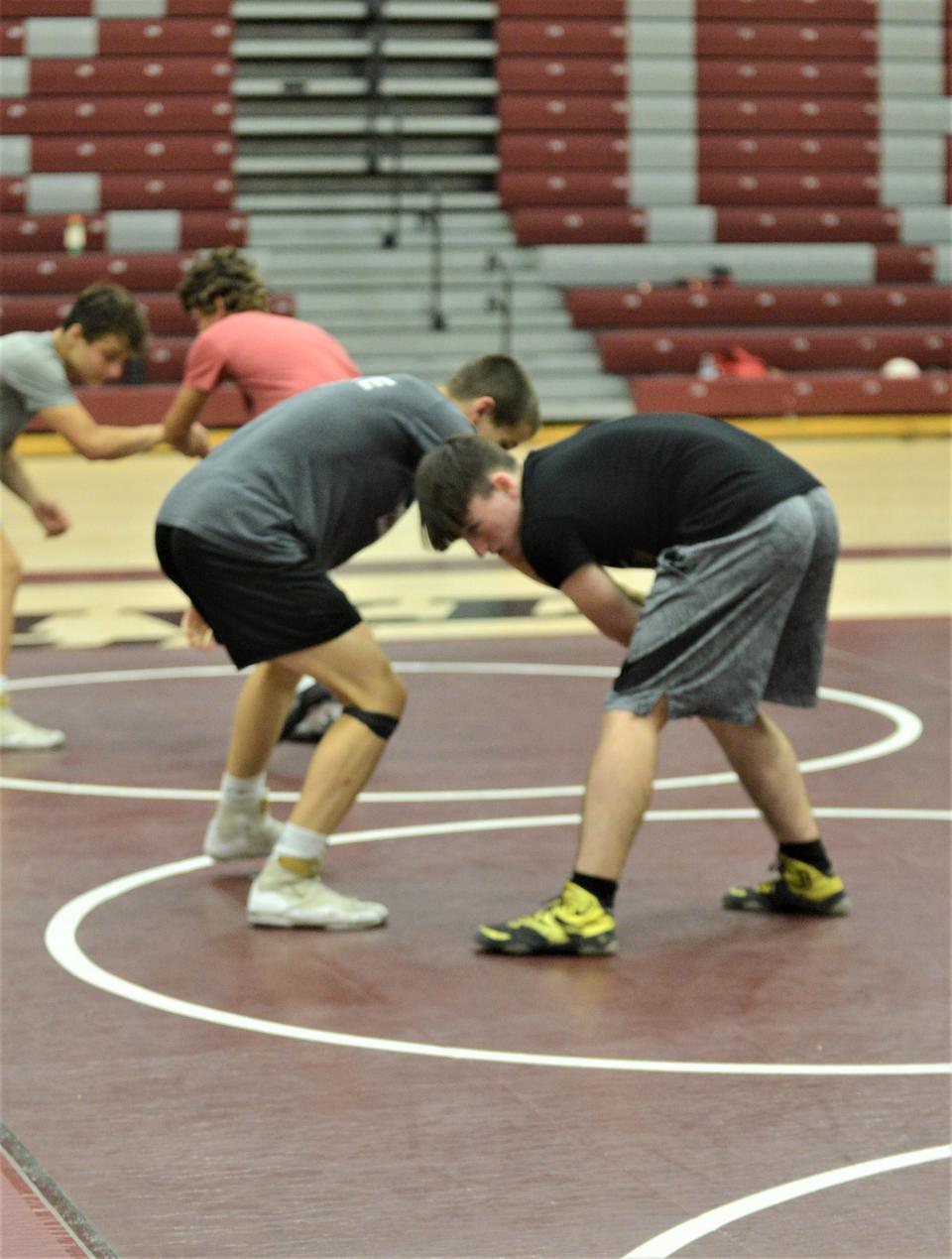 Meadowbrook's Noah Lingle (black) works with Eli Carr during the Rob Waller All-American Camp, which was held on Wednesday and Thursday at John Glenn.