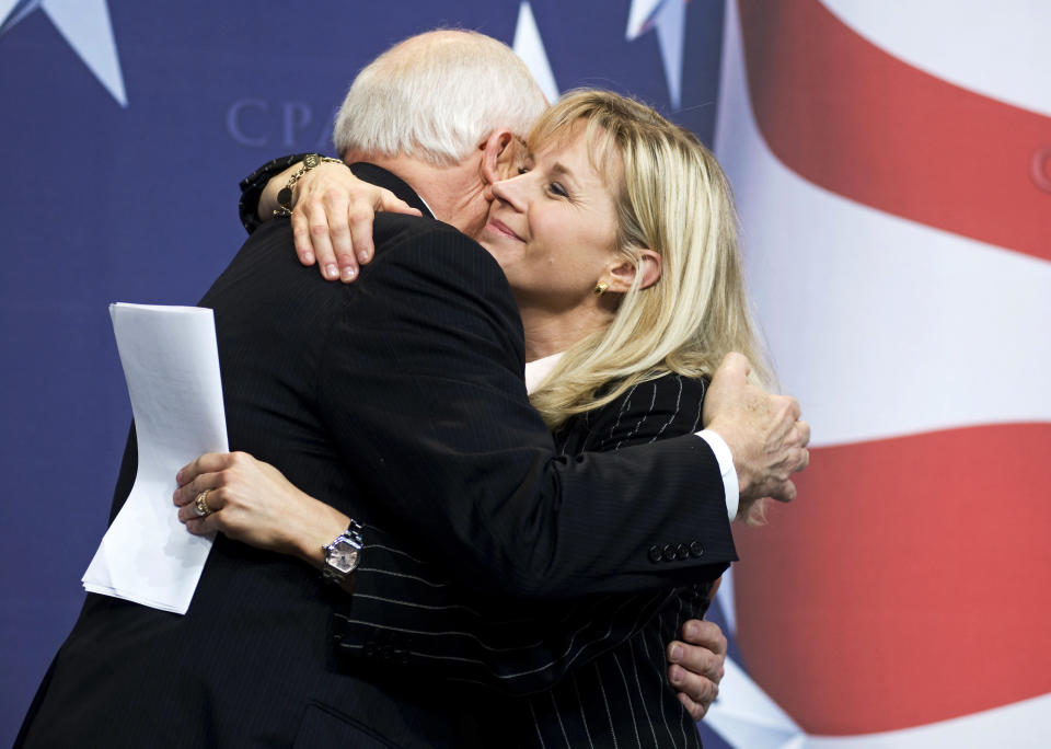 FILE - This Feb. 18, 2010 file photo shows Former Vice President Dick Cheney hugs his daughter, Liz Cheney, at the Conservative Political Action Conference (CPAC) in Washington.(AP Photo/Cliff Owen, File)