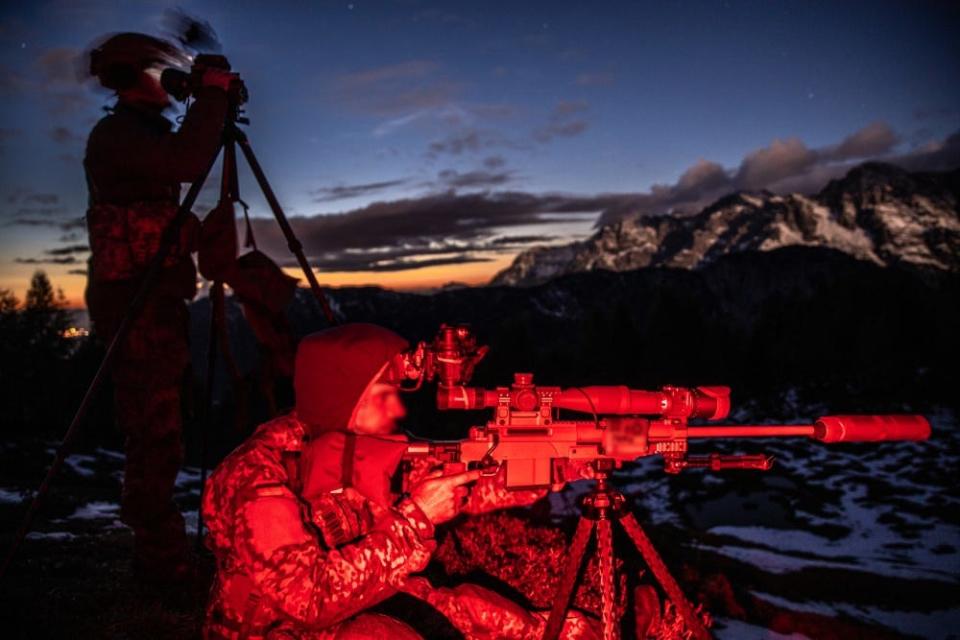 A German Special Forces Sniper team engage an elevated target at night