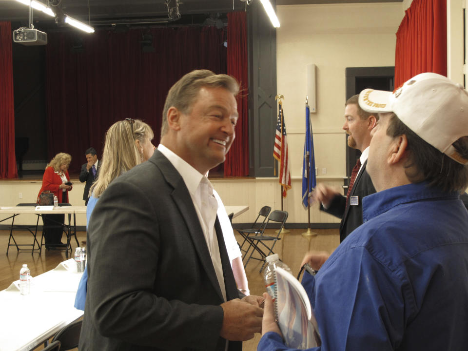 In this Friday, Sept. 14, 2018 photo, Sen. Dean Heller, R-Nev., listens to a veteran's concerns following a roundtable in Reno, Nev. Heller is considered one of the most vulnerable GOP incumbents running in November in his race against Rep. Jacky Rosen, D-Nev. Heller is set to hold his second campaign rally and fundraiser with President Donald Trump Thursday and Friday in Las Vegas. (AP Photo/Scott Sonner)