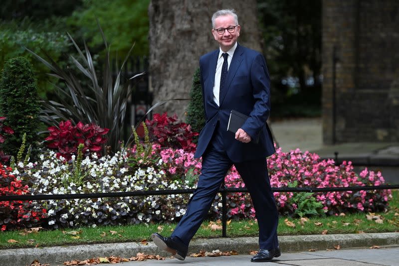 Britain's Housing Secretary Michael Gove walks outside Downing Street in London