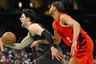 Washington Wizards forward Deni Avdija, left, is fouled by Portland Trail Blazers guard Rayan Rupert during the first half of an NBA basketball game Friday, April 5, 2024, in Washington. (AP Photo/John McDonnell)