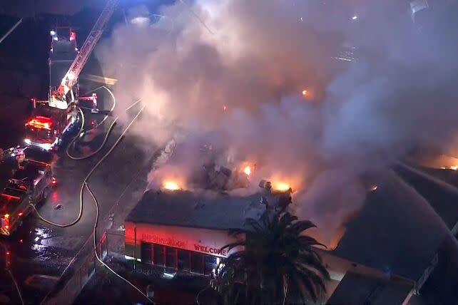 Firefighters were battling a large blaze at Manuel Dominguez High School late Monday night. Helicopter footage from local TV stations showed numerous fire engines and firefighters battling flames at the school, which is located at 15301 S San Jose Ave
