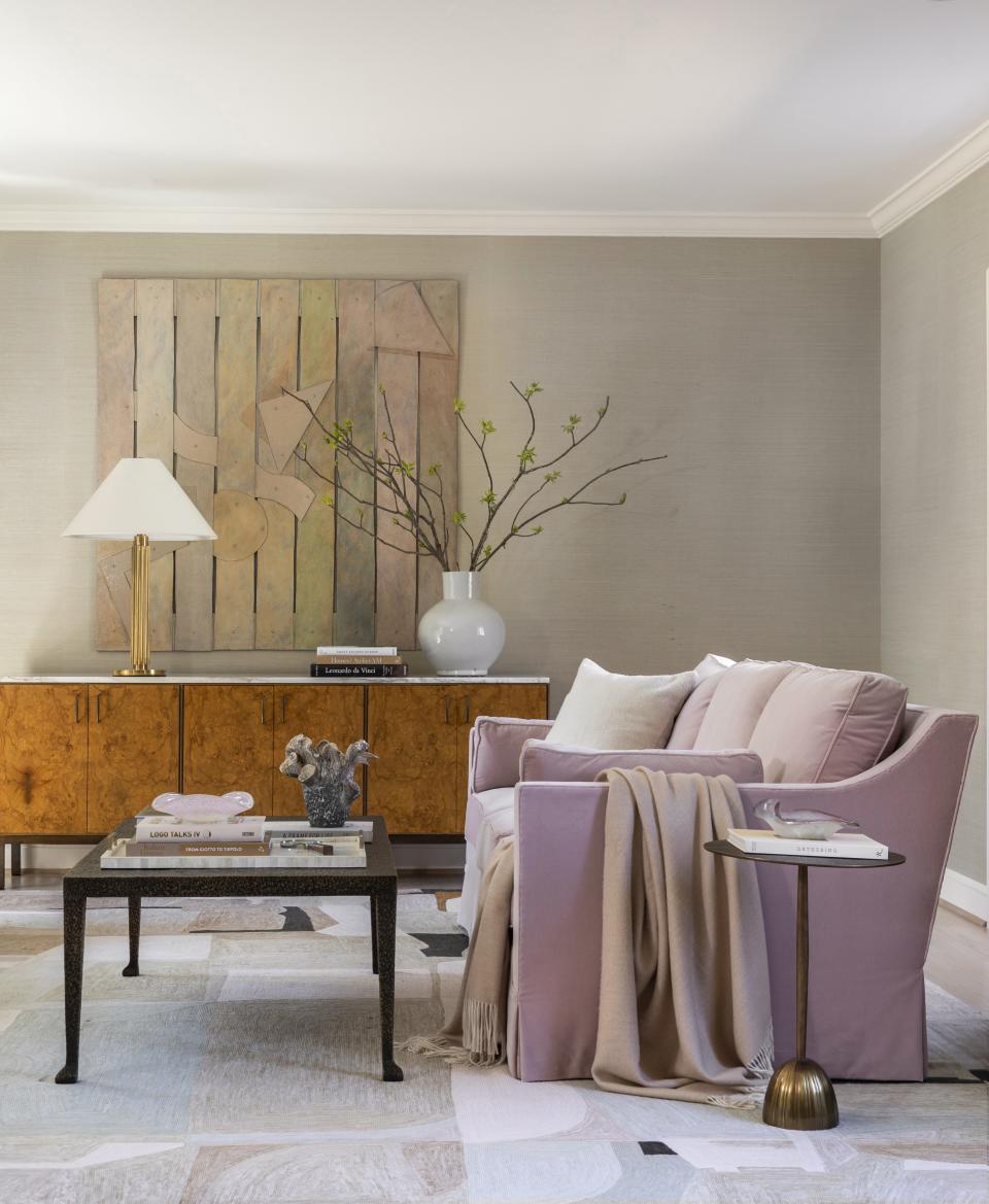 Pink living room with wooden furniture