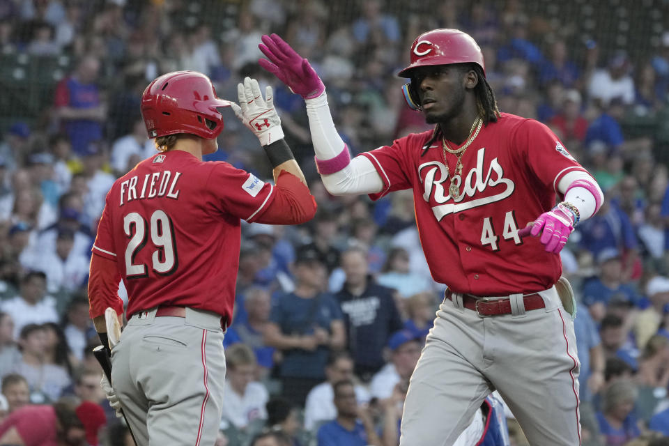 Cincinnati Reds' Elly De La Cruz, right, celebrates with TJ Friedl after hitting a solo home run against the Chicago Cubs during the first inning of a baseball game in Chicago, Thursday, Aug. 3, 2023. (AP Photo/Nam Y. Huh)