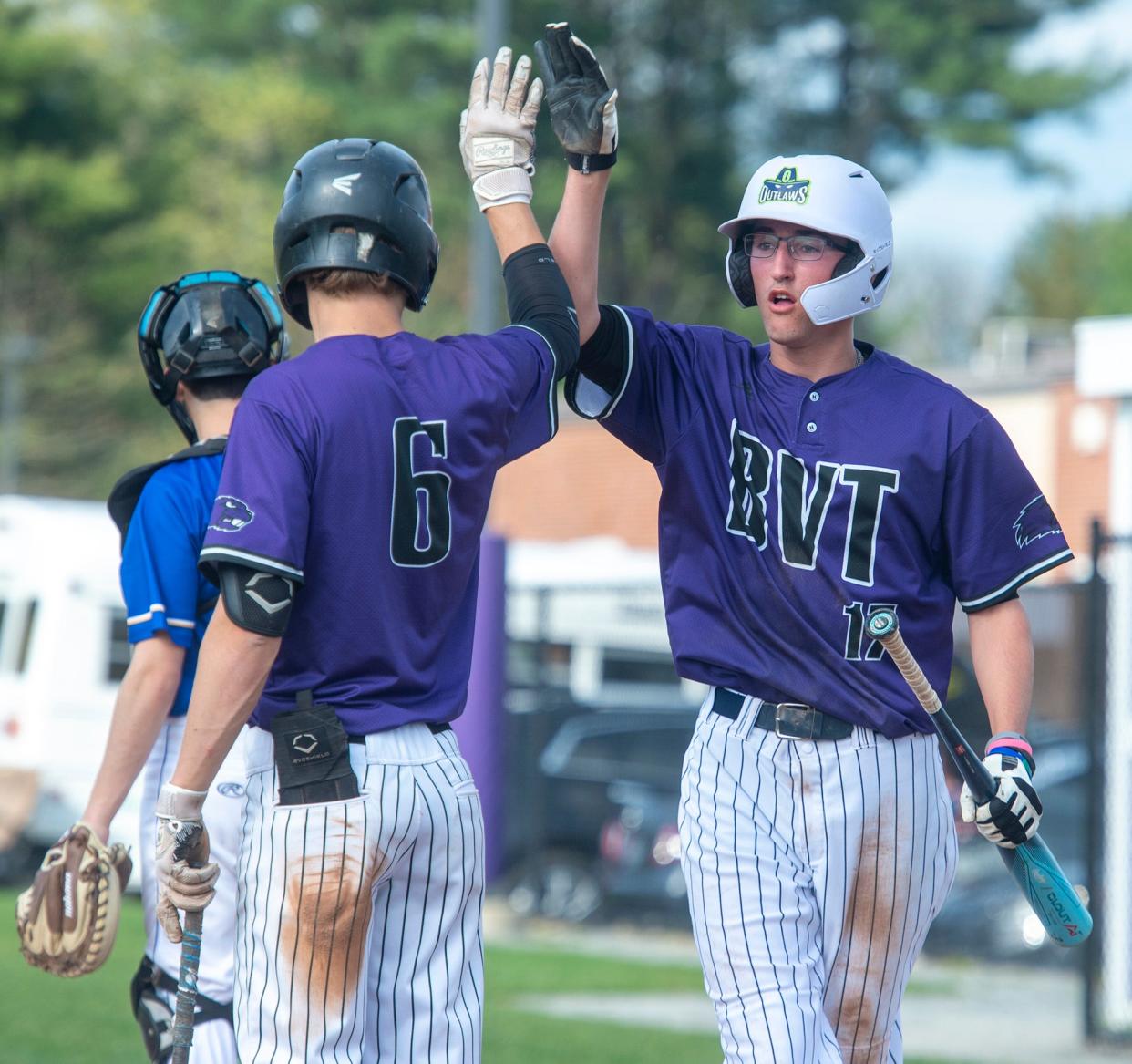 Blackstone Valley Tech senior David Garabedian, right, gets a high five from senior captain Corey Magill after scoring against Assabet Valley, May 6, 2024.