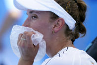 Elise Mertens, of Belgium, uses a bag of ice to cool off during a tennis†match against Ekaterina Aleksandrova, of the Russian Olympic Committee, at the 2020 Summer Olympics, Sunday, July 25, 2021, in Tokyo, Japan. (AP Photo/Patrick Semansky)