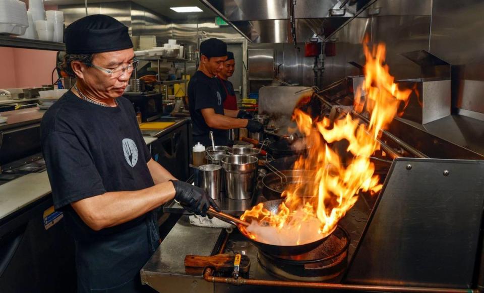 Anusorn Netpukdee cooks in the kitchen of the newly expanded Ricky Thai restaurant in North Miami.