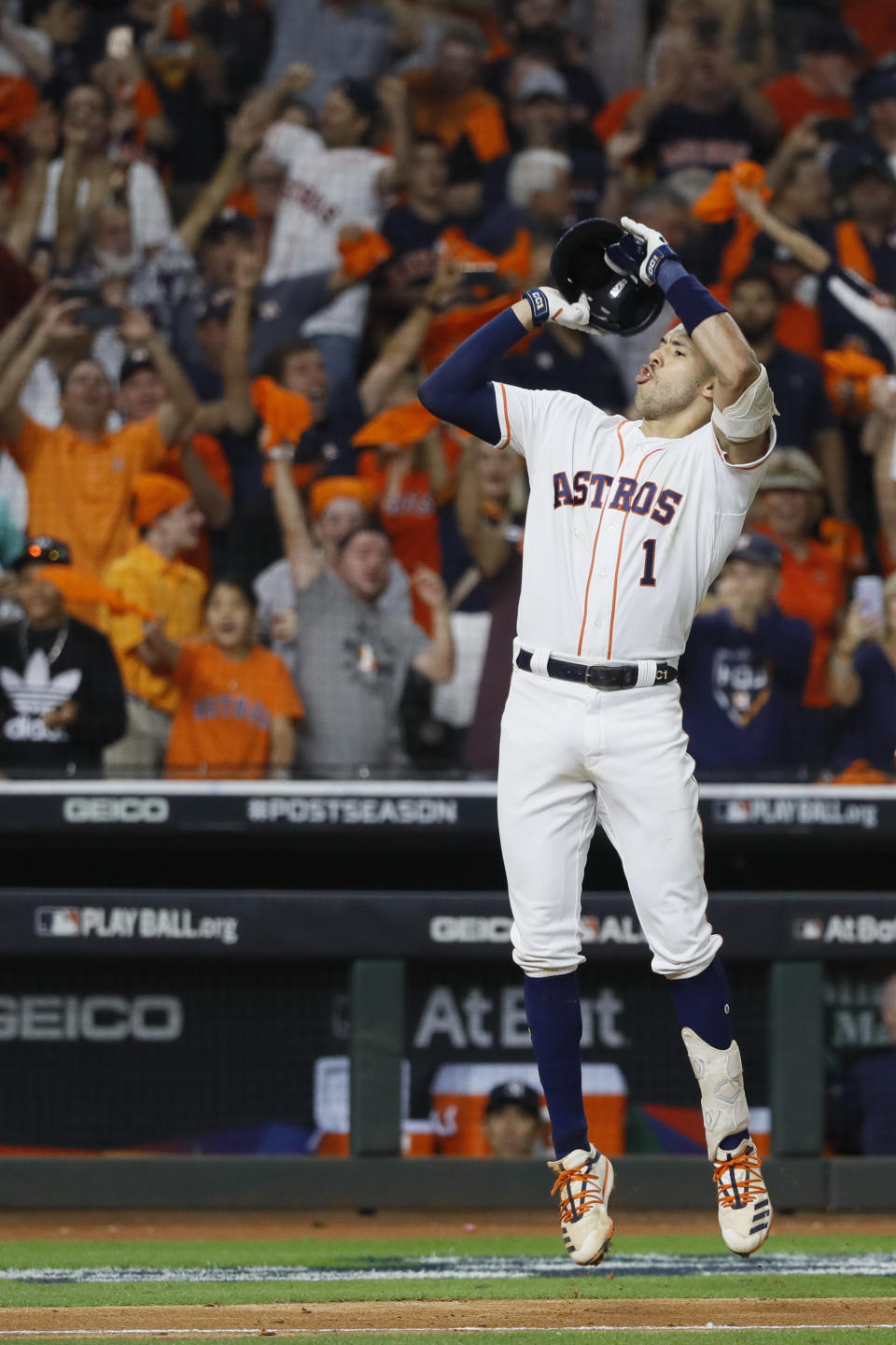 Houston Astros' Carlos Correa celebrates after his walk-off home run against the New York Yankees during the 11th inning in Game 2 of baseball's American League Championship Series Sunday, Oct. 13, 2019, in Houston. (AP Photo/Matt Slocum)