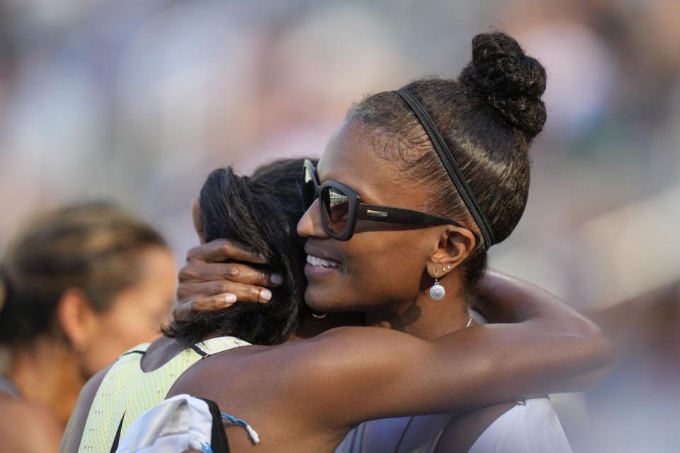 Nia Akins, left, is congratulated after winning the women's 800 meters final during the U.S. track and field championships in Eugene, Ore., Sunday, July 9, 2023. (AP Photo/Ashley Landis)