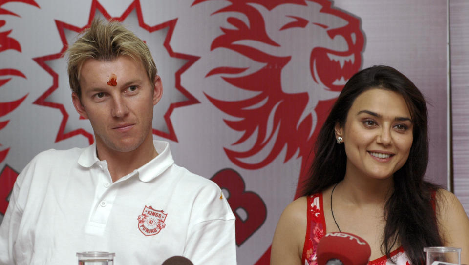 Bollywood actress Preity Zinta (R) and Australian cricketer Brett Lee attend a news conference of the IPL's Kings XI cricket team at Mohali in the northern Indian state of Punjab, April 12, 2008. The multi-million dollar Indian Premier League (IPL), featuring a majority the game's leading international players in eight franchises, one of which Zinta has bought into, will get underway on April 18 and is poised to become one of the most lucrative sporting events in Asia. REUTERS/Ajay Verma (INDIA)