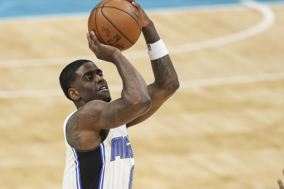 Orlando Magic guard Dwayne Bacon shoots against the Charlotte Hornets during the second half of an NBA basketball game in Charlotte, N.C., Friday, May 7, 2021. (AP Photo/Nell Redmond)