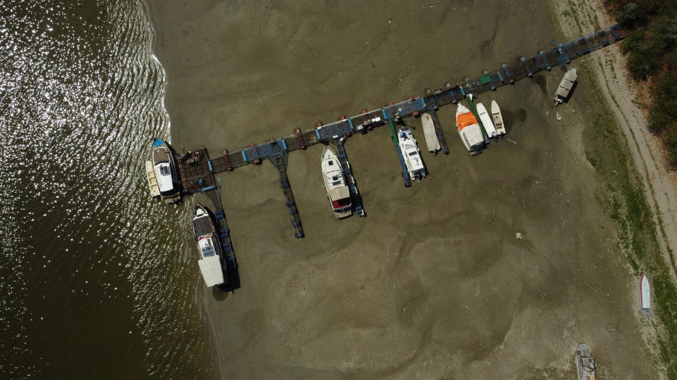 Boats lie on the dried river bed of the Danube in the city of Novi Sad, Serbia, on Aug. 16, 2022. / Credit: FEDJA GRULOVIC / REUTERS