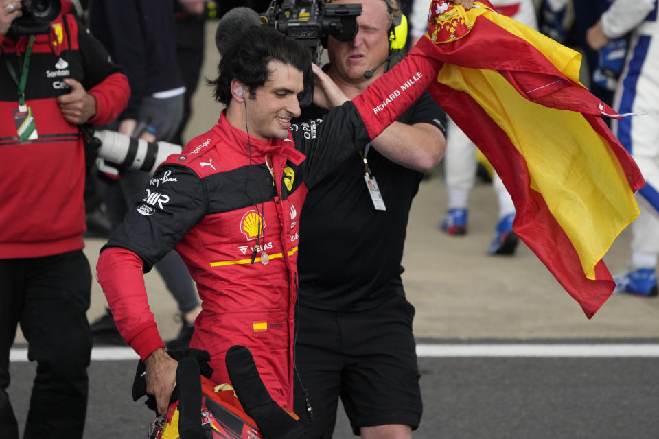 Ferrari driver Carlos Sainz of Spain celebrates after winning the British Formula One Grand Prix at the Silverstone circuit, in Silverstone, England, Sunday, July 3, 2022. (AP Photo/Matt Dunham)