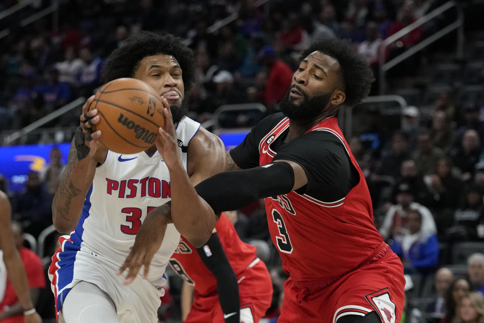 Chicago Bulls center Andre Drummond (3) fouls Detroit Pistons forward Marvin Bagley III (35) during the first half of an NBA basketball game, Wednesday, March 1, 2023, in Detroit. (AP Photo/Carlos Osorio)