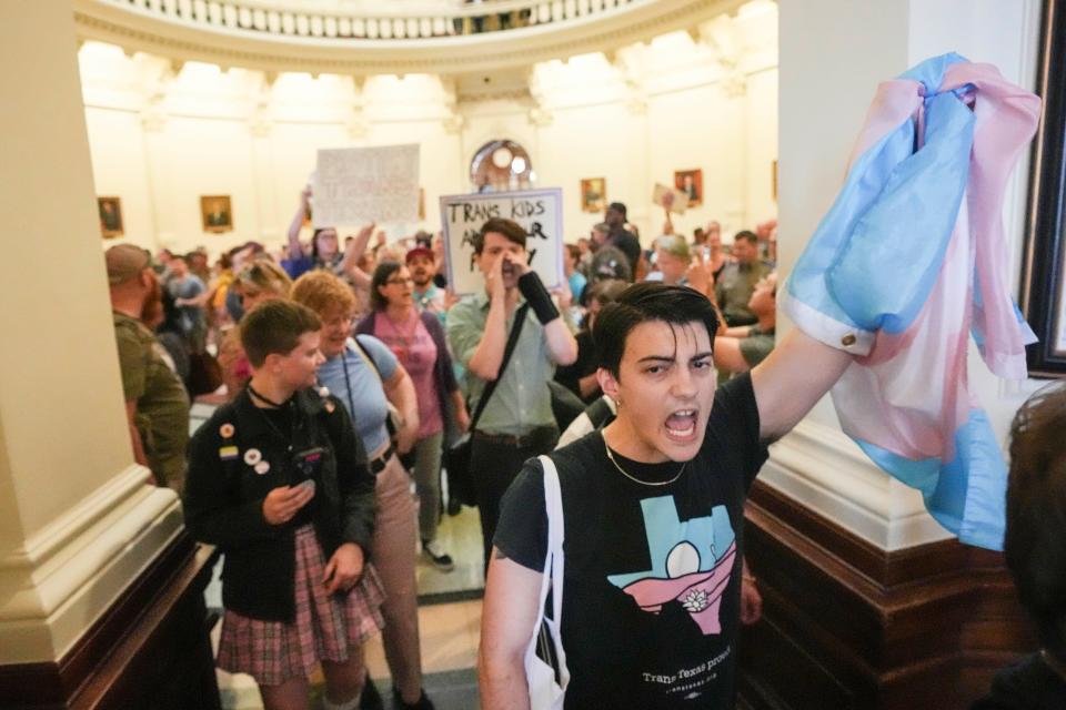 May 2, 2023; Austin, TX, USA; Landon Richie and LGBTQ rights activists are escorted out of the Capitol as they protest SB14 at the Capitol of Texas Tuesday, May 2, 2023. SB14 would ban gender-affirming medical care for transgender children. Mandatory Credit: Mikala Compton-USA TODAY NETWORK ORIG FILE ID:  20230502_ajw_usa_126.JPG