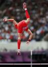 Yansheng Yang of China clears the bar in the men's Pole Vault qualification at the London 2012 Olympic Games Athletics, Track and Field events at the Olympic Stadium, London, Britain, 08 August 2012. EPA/DIEGO AZUBEL