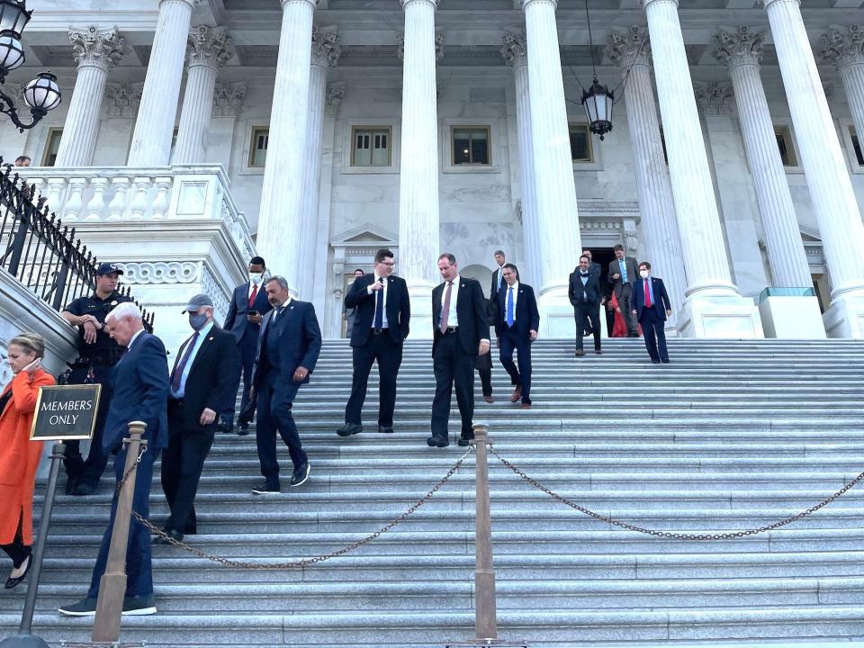 House members walking down the steps outside the chamber in September 2021.