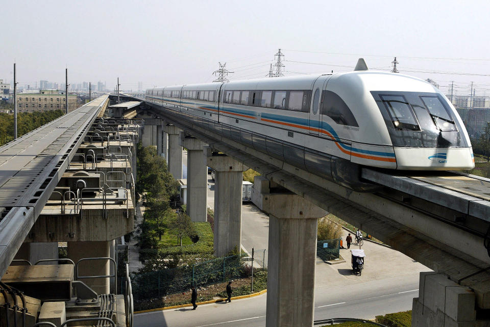 A maglev train drives into a terminal station in Shanghai March 14, 2006. French engineering group Alstom aims to increase its metro equipment sales in China this year as the nation's cities expand their subway networks, a top company executive said on Tuesday. REUTERS/Ming Ming