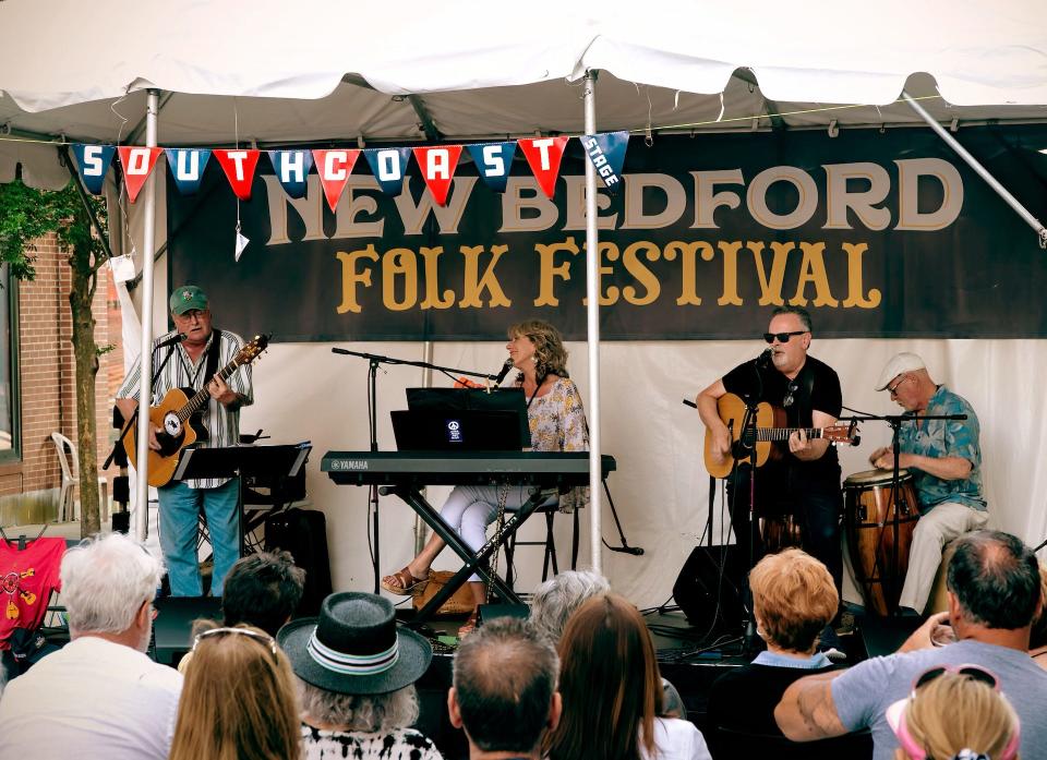 People gather on Purchase Street, in 2019, to enjoy the New Bedford Folk Festival. The event returns, after a two year break, on July 9.