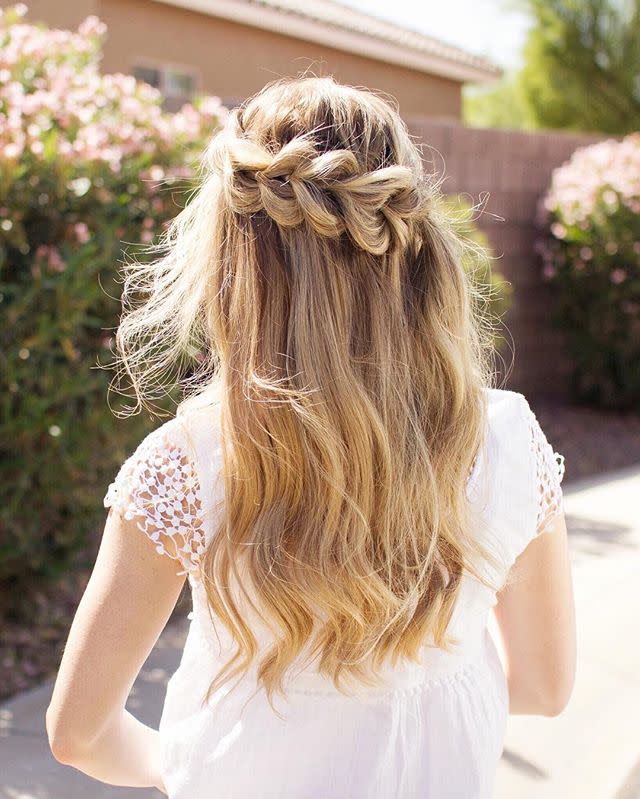 <p>A pulled-through braid adds another dimension of texture to a basic half-up waterfall. </p>