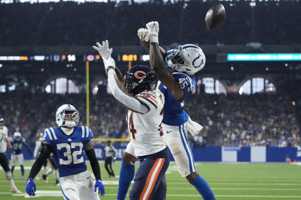 Indianapolis Colts linebacker E.J. Speed (45) breaks ups two-point conversion attempts in tended for Chicago Bears running back Khalil Herbert (24) during the second half of an NFL football game Sunday, Sept. 22, 2024, in Indianapolis. (AP Photo/Michael Conroy)