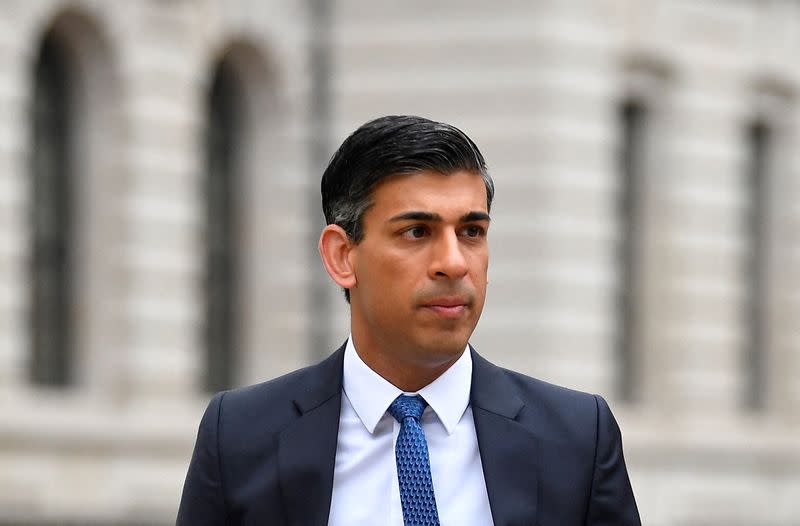 FILE PHOTO: British Chancellor Sunak walks, London