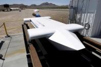 A man looks over a mock-up of a test sled following a propulsion open-air test at Hyperloop One in North Las Vegas, Nevada, U.S. May 11, 2016. REUTERS/Steve Marcus