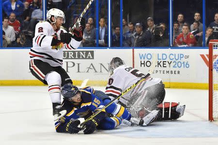 Chicago Blackhawks defenseman Duncan Keith (2) checks St. Louis Blues center Robby Fabbri (15) in front of Chicago Blackhawks goalie Corey Crawford (50) during the second period in game seven of the first round of the 2016 Stanley Cup Playoffs at Scottrade Center. Mandatory Credit: Jasen Vinlove-USA TODAY Sports