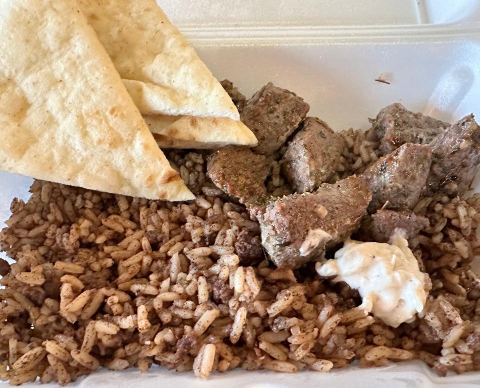 The steak platter at MATA Mediterranean Grill in Jackson Township is served with rice pilaf, pita and tzatziki sauce.