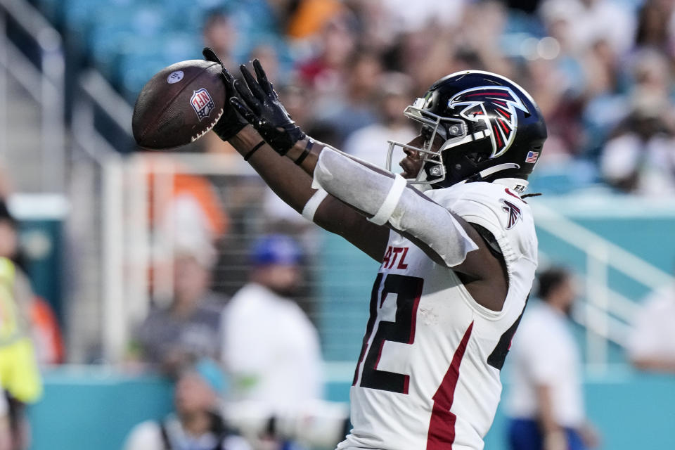 Atlanta Falcons running back Godwin Igwebuike (42) reacts after scoring a touchdown in the first half of a preseason NFL football game against the Miami Dolphins, Friday, Aug. 11, 2023, in Miami Gardens, Fla. (AP Photo/Wilfredo Lee)