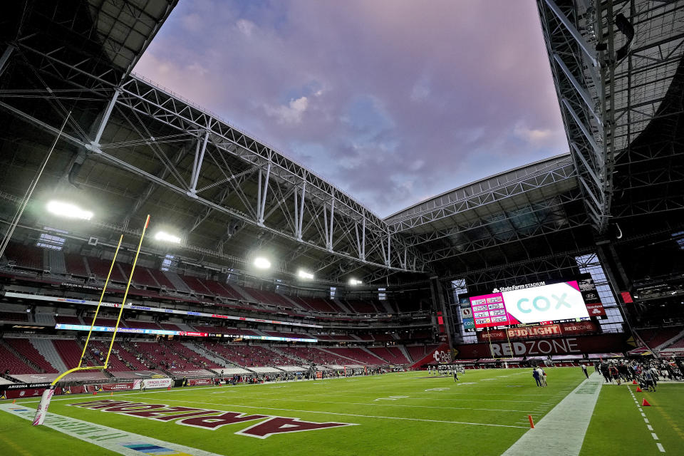 FILE - In this Sunday, Oct. 25, 2020, file photo, the Seattle Seahawks and the Arizona Cardinals compete during the first half of an NFL football game in Glendale, Ariz. The San Francisco 49ers are set to embark on an unusual three-week road trip after being kicked out of their stadium and practice facility because of strict new COVID-19 protocols in their home county in Northern California. The Niners will fly to Arizona, where they will practice, live and play their next two games after Santa Clara County imposed a three-week ban on games and practices for contact sports. (AP Photo/Ross D. Franklin, File)