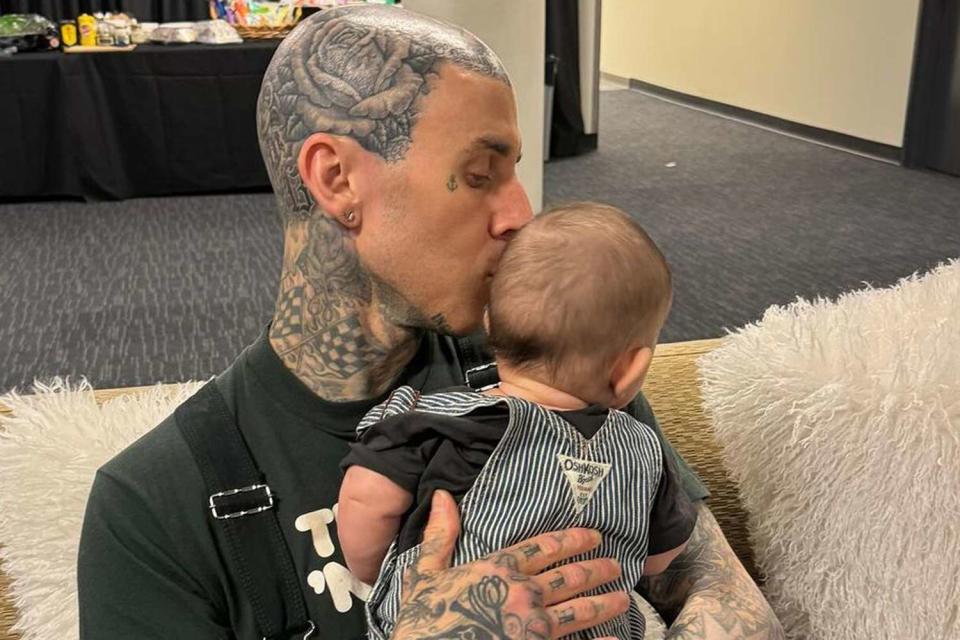 <p>Kourtney Kardashian/Instagram</p> Travis Barker and his son, Rocky Thirteen