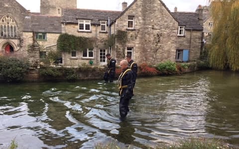 A police team searches a mill pond in Swanage, Dorset, after 19-year-old Gaia Pope - Credit: Jennifer Cockerell/PA