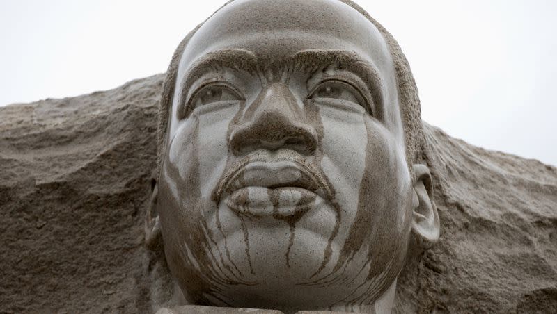 Rain runs down the face of the Martin Luther King Jr. Memorial in Washington, Tuesday, Aug. 13, 2013. 