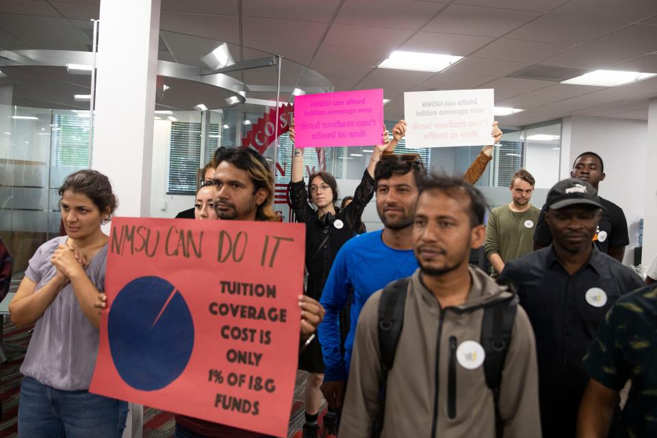 NMSU graduate students and union present a petition to representatives of Chancellor Dan Arvizu's office on Thursday, June 9, 2022.