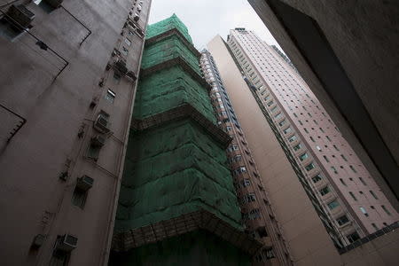 Parkcrest, a residential tower, is seen under construction at Sai Ying Pun district in Hong Kong, China July 16, 2015. REUTERS/Tyrone Siu