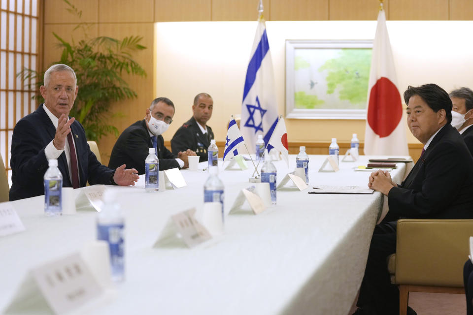 Israeli Defense Minister Benny Gantz, left, and Japan's Foreign Minister Yoshimasa Hayashi hold their bilateral talk at the Foreign Ministry in Tokyo Tuesday, Aug. 30, 2022. (AP Photo/Shuji Kajiyama)