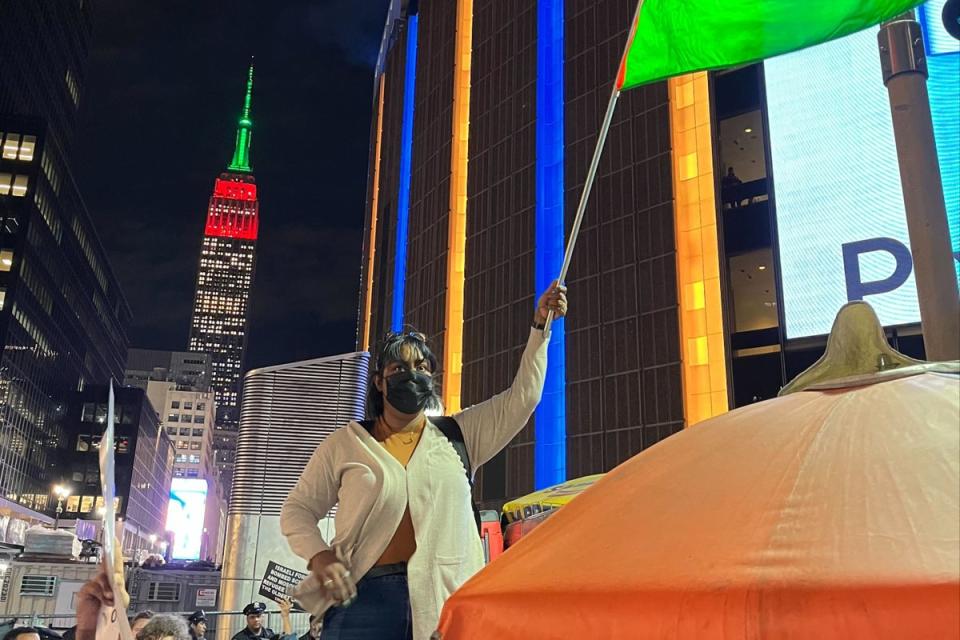 Protesters in New York City demanding a ceasefire in the Israel-Hamas war are seen in front of the Empire State Building. (Tom Richell / The Independent)