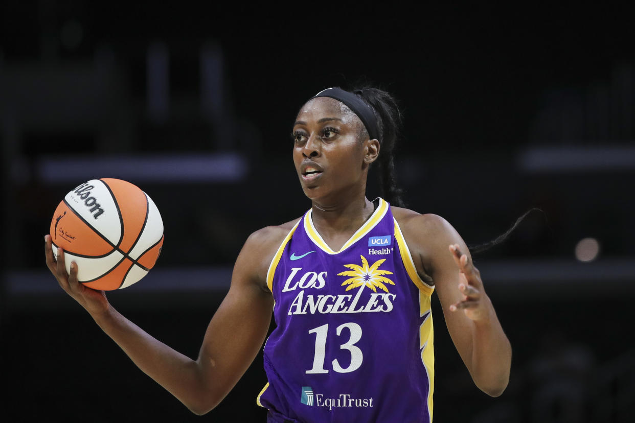 LOS ANGELES, CALIFORNIA - JULY 04: Chiney Ogwumike #13 of the Los Angeles Sparks looks to pass the ball in the first half against the Phoenix Mercury at Crypto.com Arena on July 04, 2022 in Los Angeles, California. NOTE TO USER: User expressly acknowledges and agrees that, by downloading and or using this photograph, User is consenting to the terms and conditions of the Getty Images License Agreement. (Photo by Meg Oliphant/Getty Images)