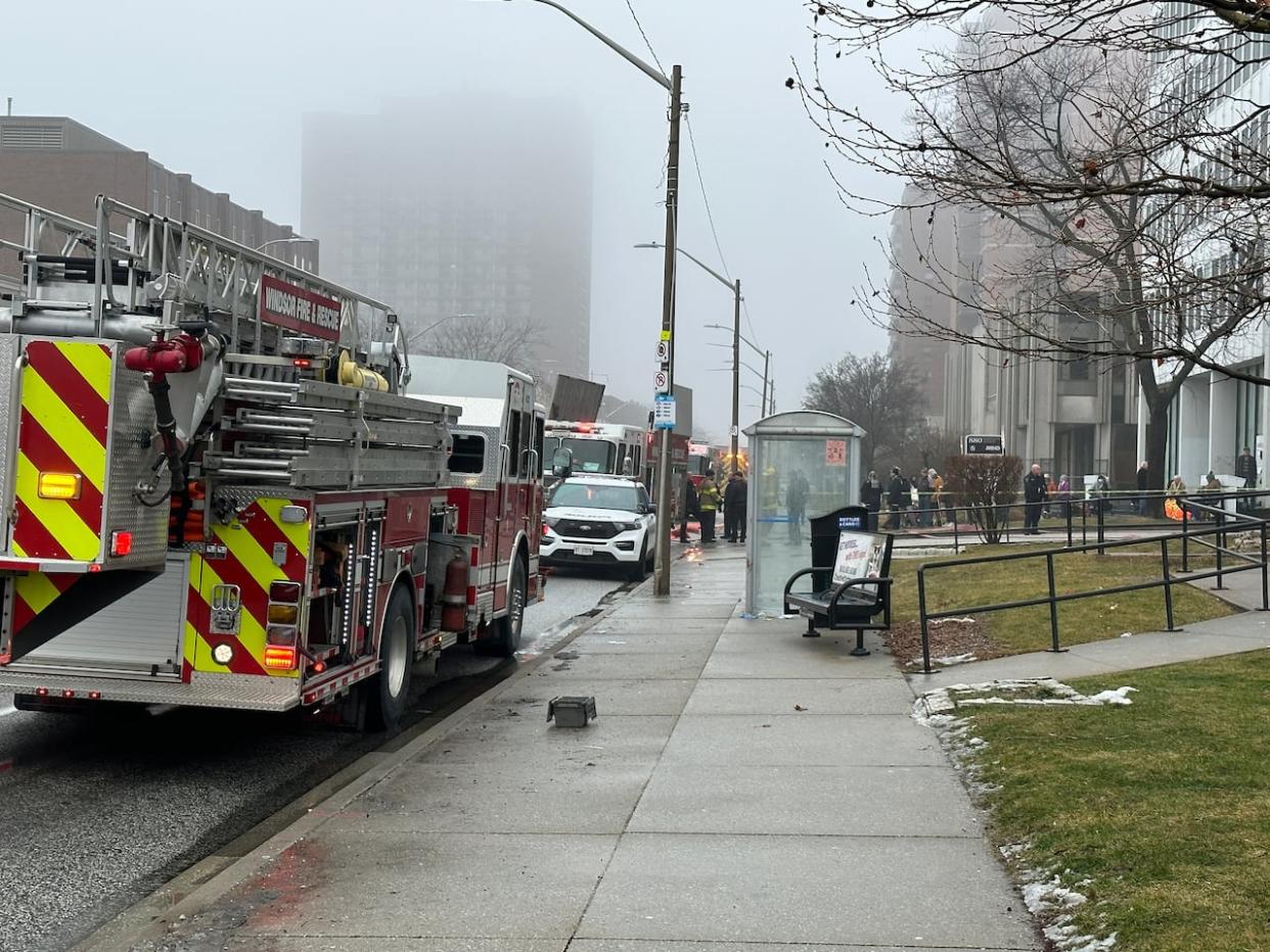 Firefighters and police had a large presence at 920 Ouellette Avenue on Thursday, Jan. 25, 2024 for a fire on the 10th floor of the building.  (Dale Molnar/CBC - image credit)