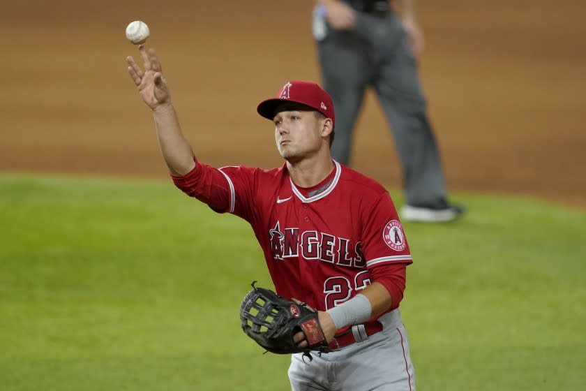 Los Angeles Angels second baseman Matt Thaiss throws to first for the out on a grounder by Texas Rangers' Jose Trevino during the fourth inning of a baseball game in Arlington, Texas, Tuesday, Sept. 8, 2020. (AP Photo/Tony Gutierrez)