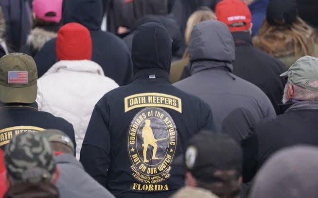 A member of the Oath Keepers attends a rally protesting the 2020 elections.