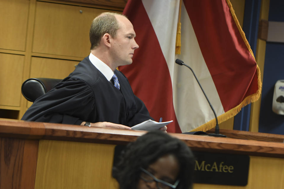 Judge Scott McAfee presides during a hearing on charges against former President Donald Trump in the Georgia election interference case on Thursday, March 28, 2024 in Atlanta. Lawyers for Trump argued in a court filing that the charges against him in the Georgia election interference case seek to criminalize political speech and advocacy conduct that is protected by the First Amendment. (Dennis Byron/Hip Hop Enquirer via AP)