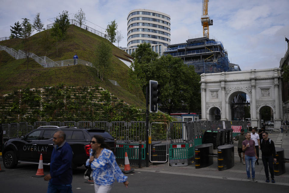 A view of the newly built "Marble Arch Mound" after it was opened to the public next to Marble Arch in London, Tuesday, July 27, 2021. The temporary installation commissioned by Westminster Council and designed by architects MVRDV has been opened as a visitor attraction to try and entice shoppers back to the adjacent Oxford Street after the coronavirus lockdowns. (AP Photo/Matt Dunham)