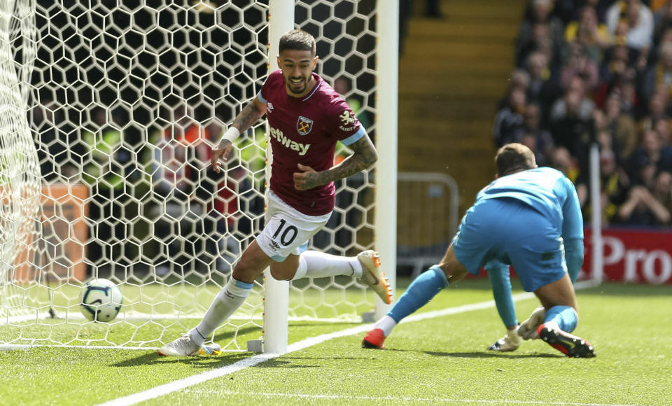 West Ham United's Manuel Lanzini celebrates scoring his side's second goal , during the English Premier League soccer match between Watford and West Ham United, at Vicarage Road, in Watford, England, Sunday May 12, 2019. (Paul Harding/PA via AP)