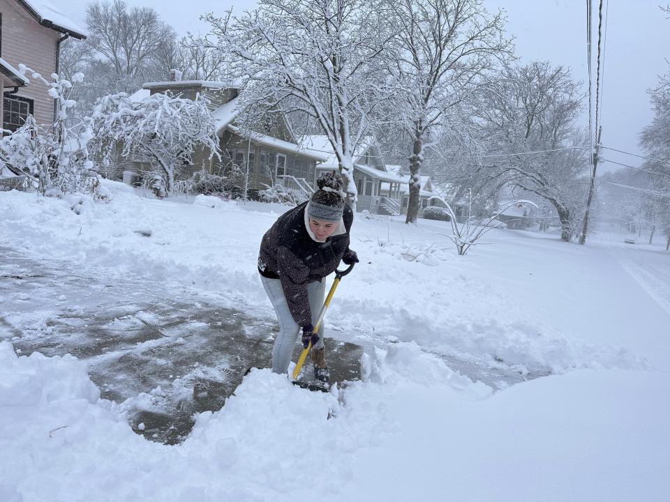 Laura Burianov shovels her driveway Tuesday, Jan. 9, 2024 in Des Moines, Iowa. It was the first significant snowfall of this winter in area. (AP Photo/Scott McFetridge)